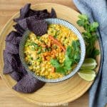 Elote-Corn-dip-with-poblano-peppers-in-bowl-with-chips