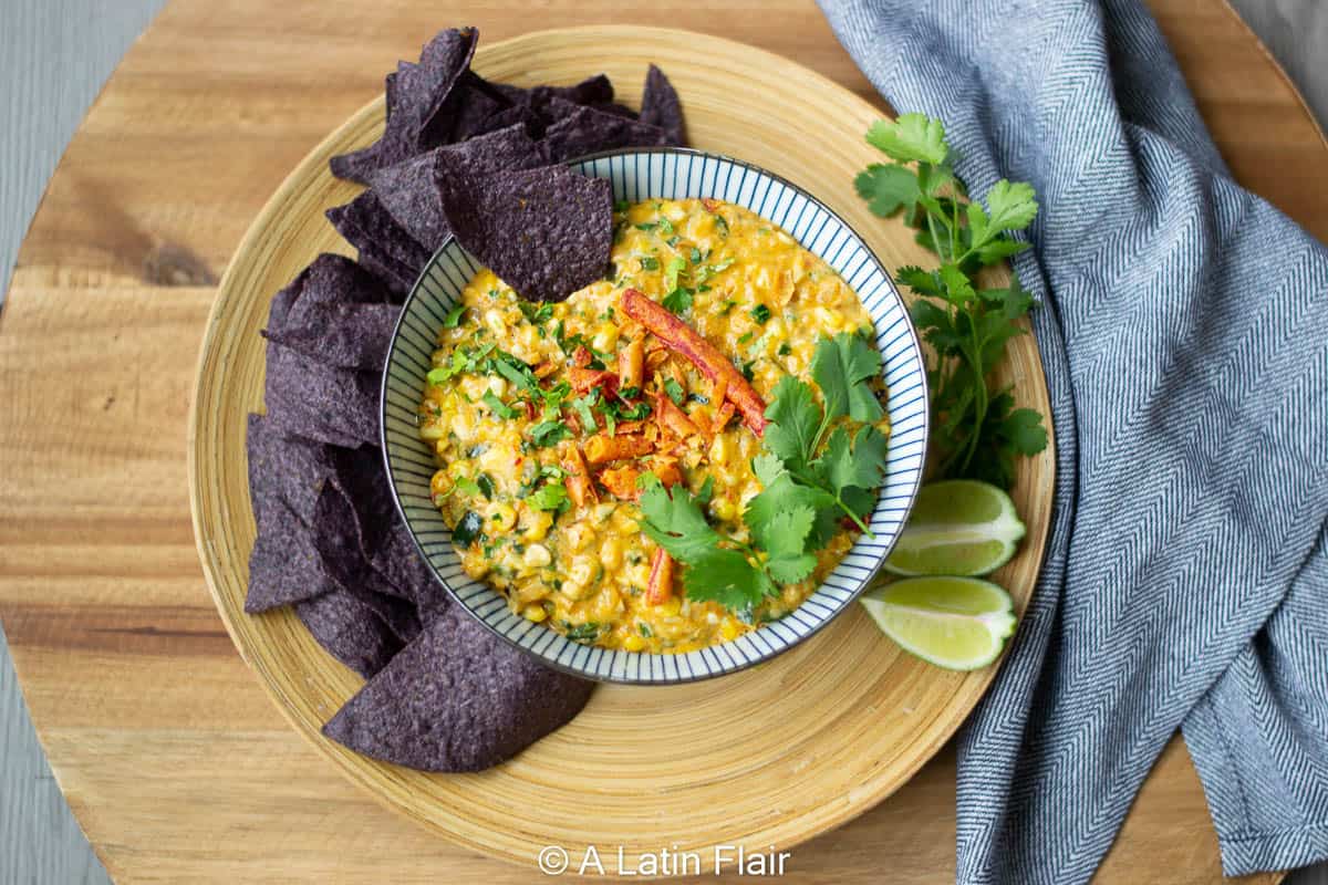 Elote-Corn-dip-with-poblano-peppers-in-bowl-with-chips