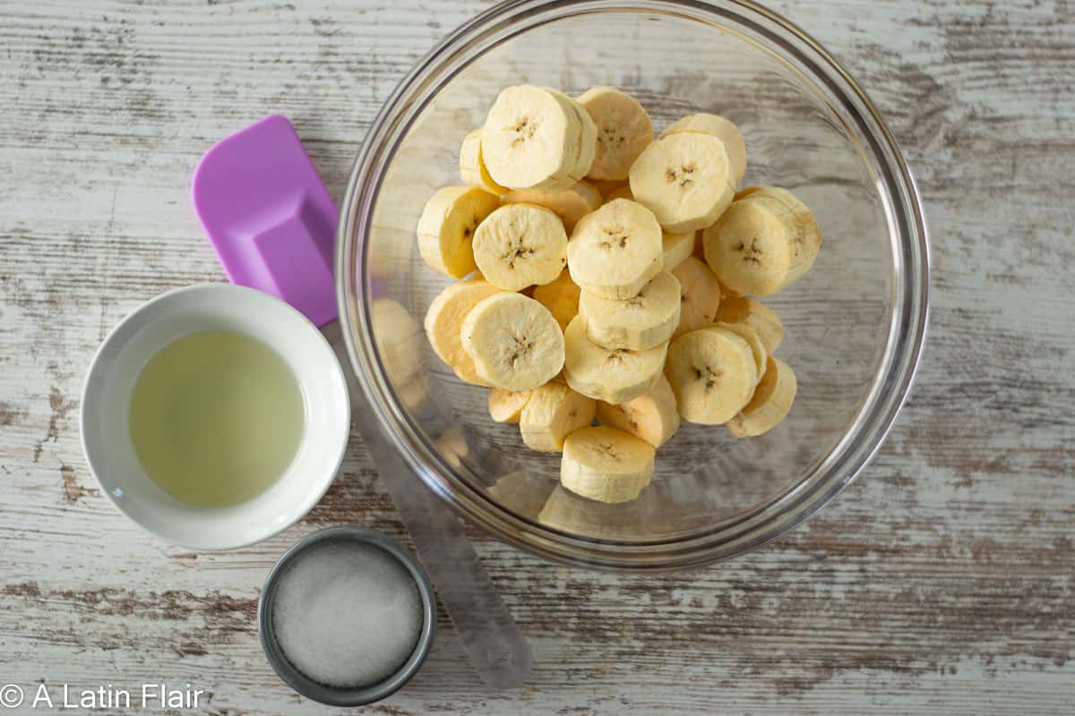 green-plantains-slices-in-a-bowl-for-Oven-Baked-tostones