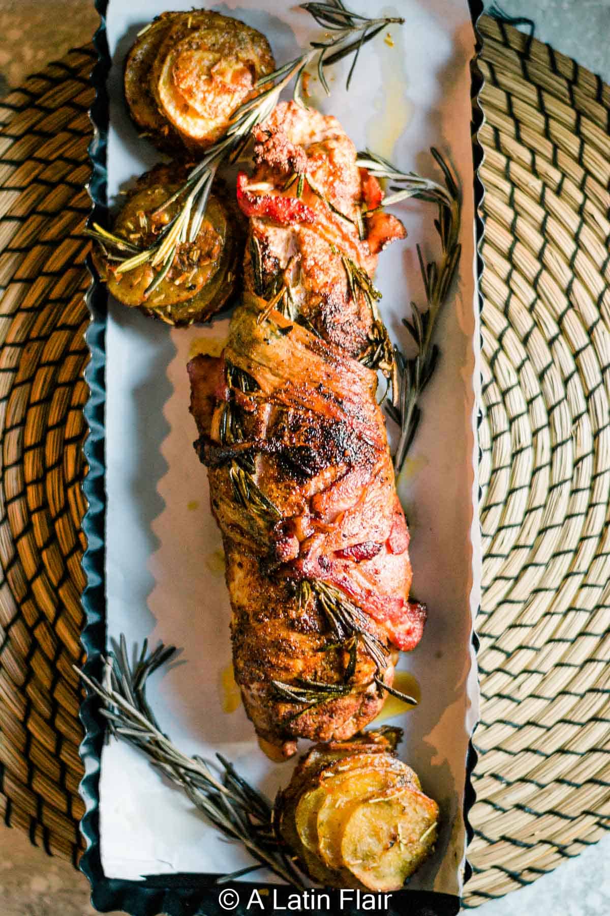 chipotle-Bacon-Wrapped-Pork-Tenderloin-served-on-rectangular-dish