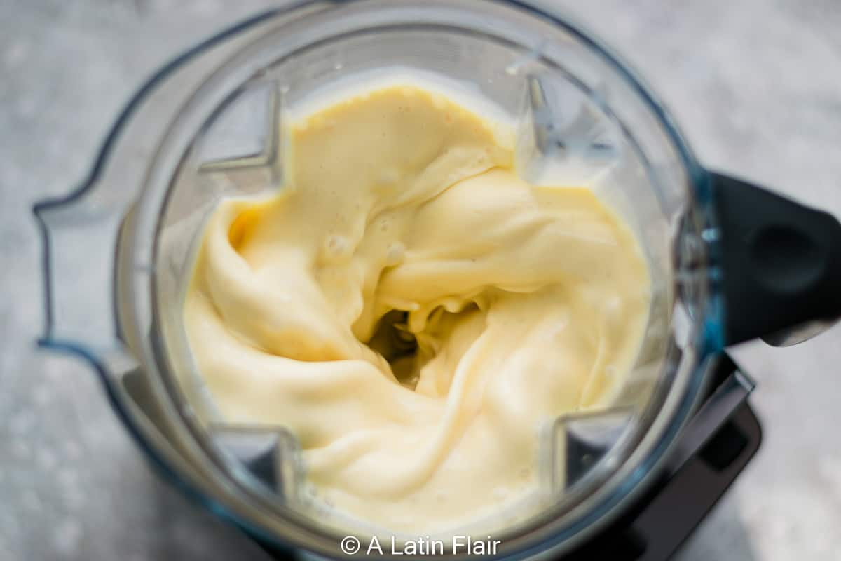 blending ingredients for coconut flan (flan de coco)