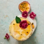 Skinny-Passion-Fruit-Margarita-Cocktail-garnished-with-flowers