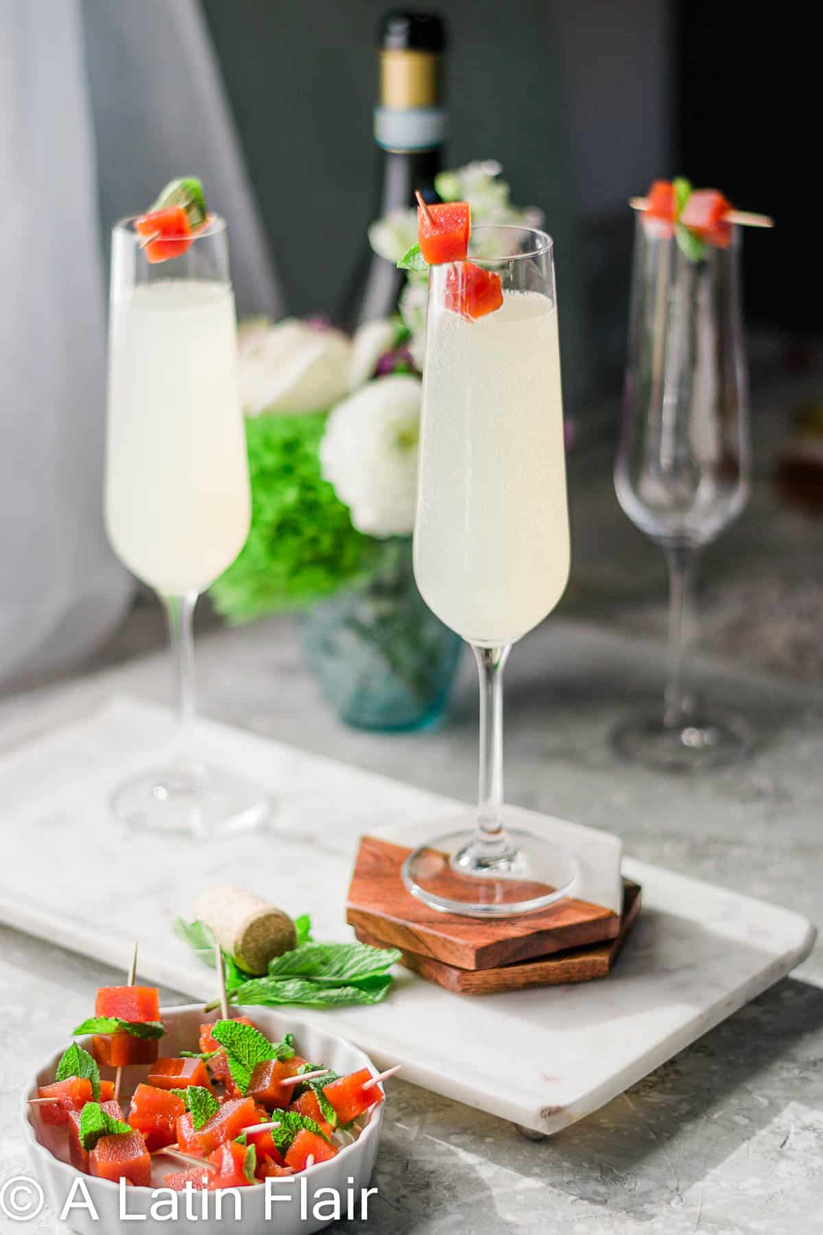 Guava-mimosas-in-flute-glass-with-guava-paste-garnish