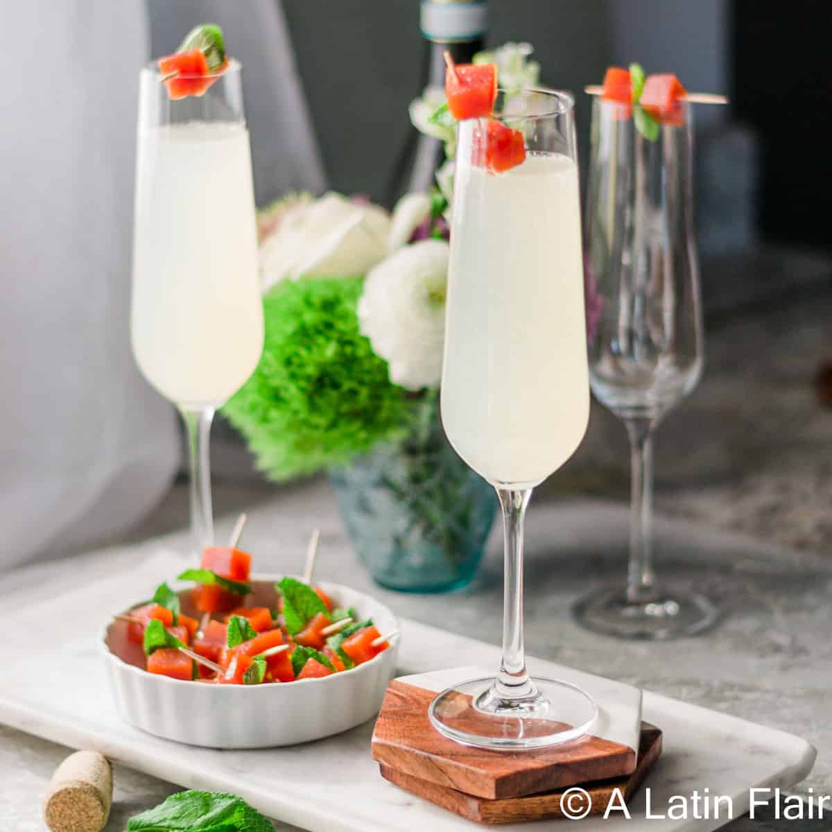 Guava-mimosas-in-flute-glass-with-guava-paste-garnish