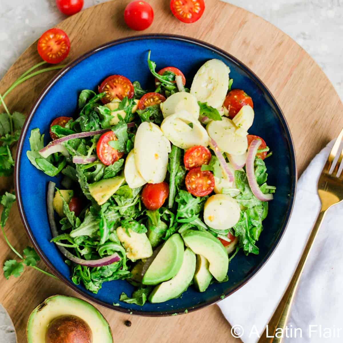 hearts-of-palm-salad-with-vegan-avocado-dressing-in-blue-bowl