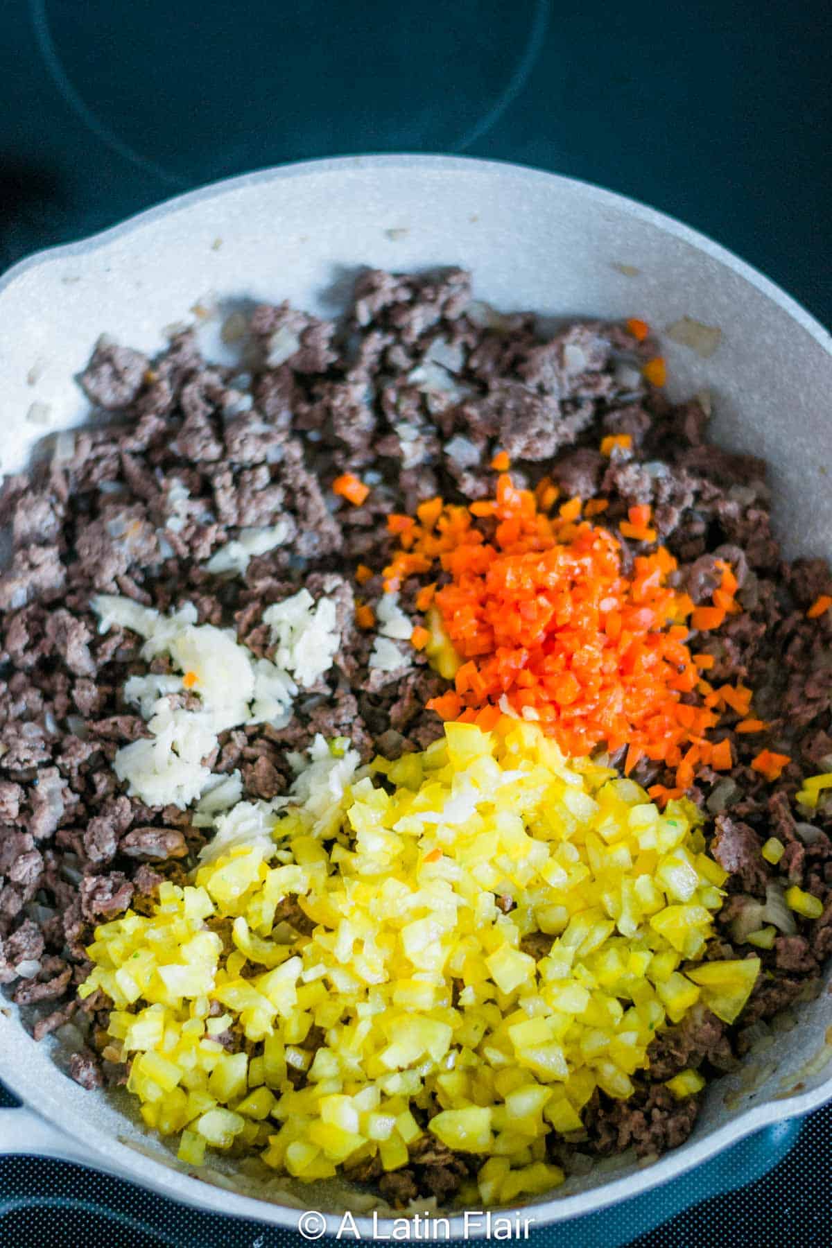 cooking-Puerto-rican-picadillo-in-a-frying-pan