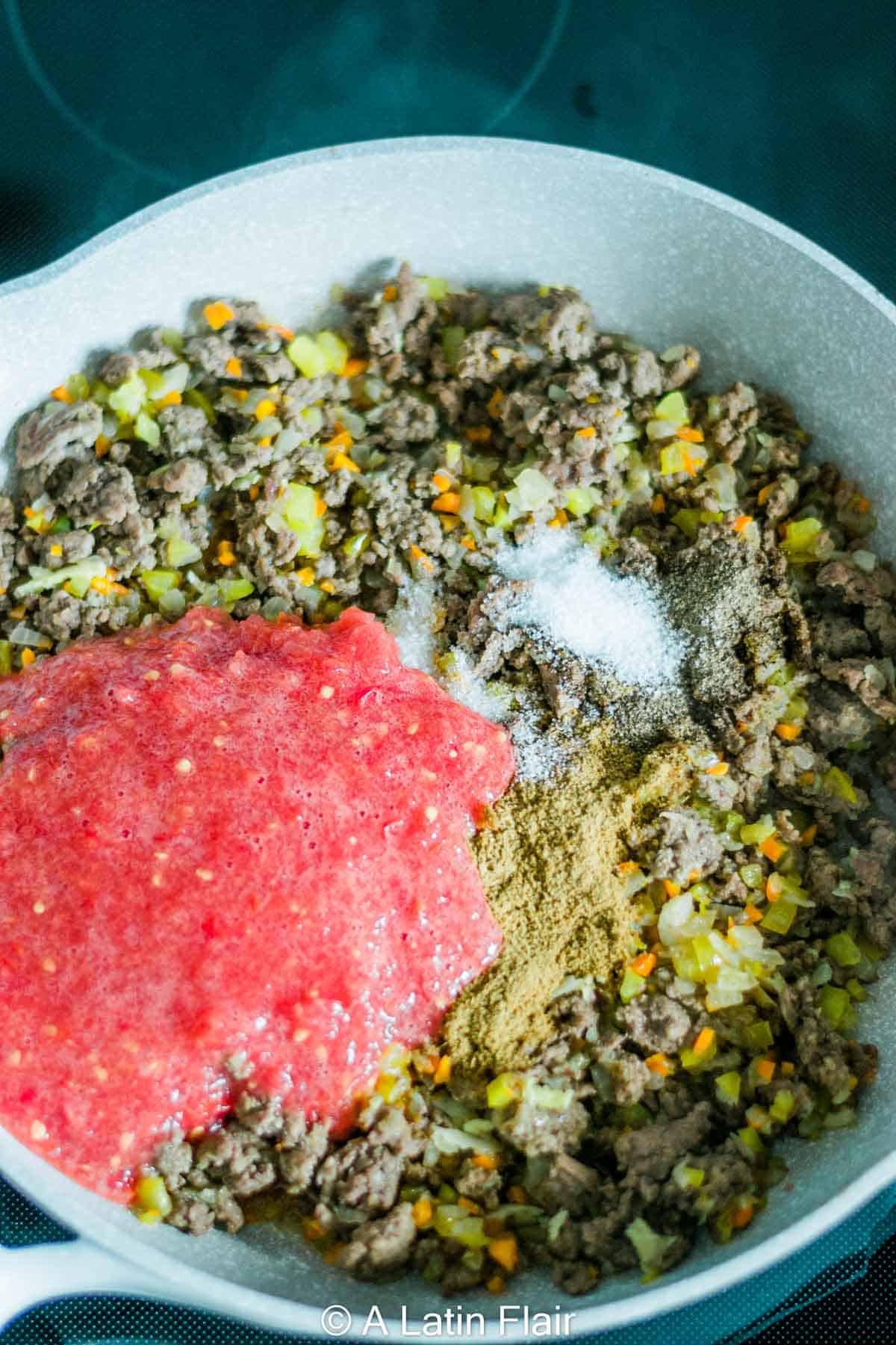 cooking-Puerto-rican-picadillo-in-a-frying-pan