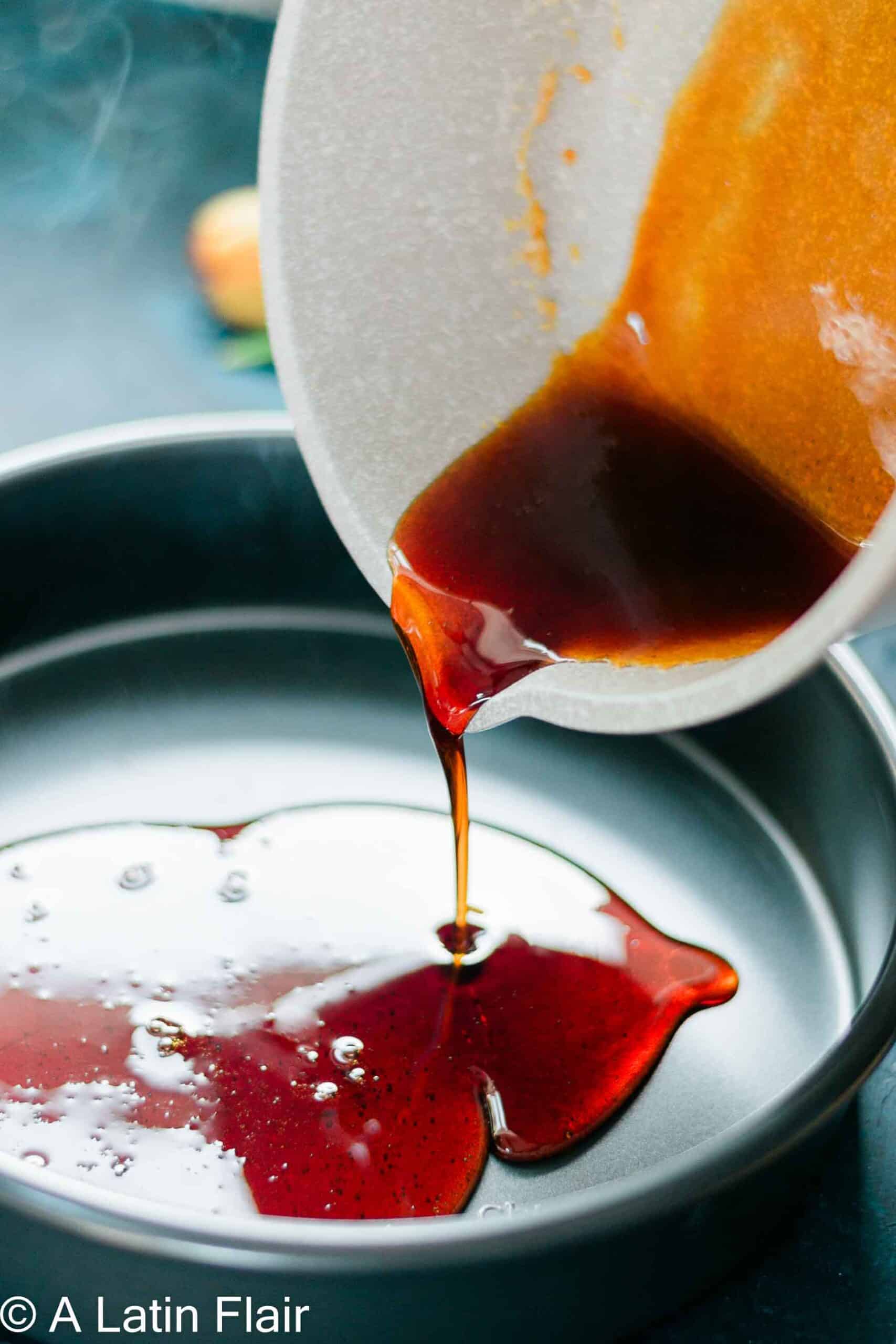 pouring caramel for Orange Flan Recipe (Flan de Queso con Naranja)