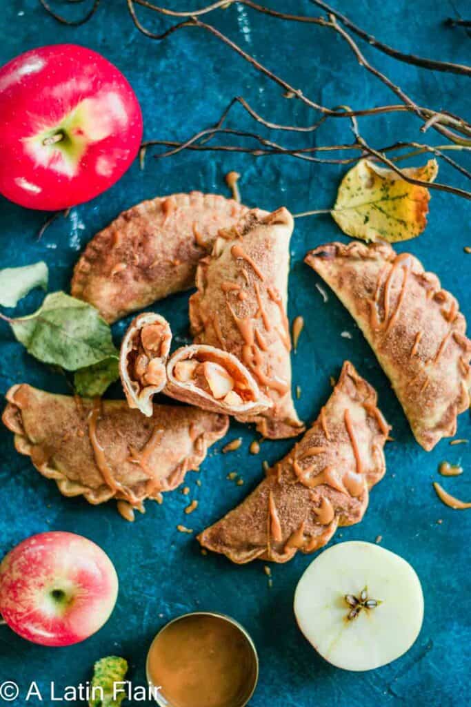 Dulce de Leche and Apple Empanadas served on blue background