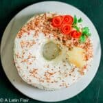 carrot cake with pineapple and coconut on white serving plate