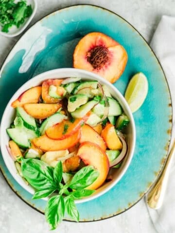 Peach Avocado Salad on blue plate