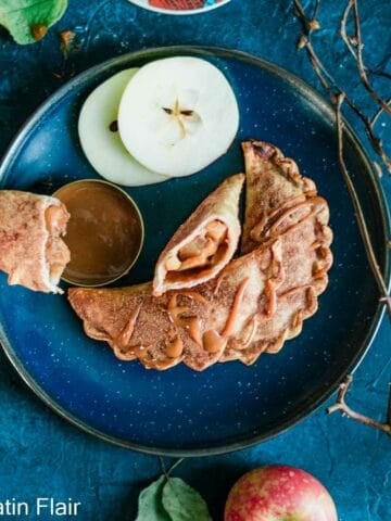 Dulce de Leche and Apple Empanadas served on blue plate