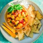 Homemade Peach and Mango Salsa on white plate