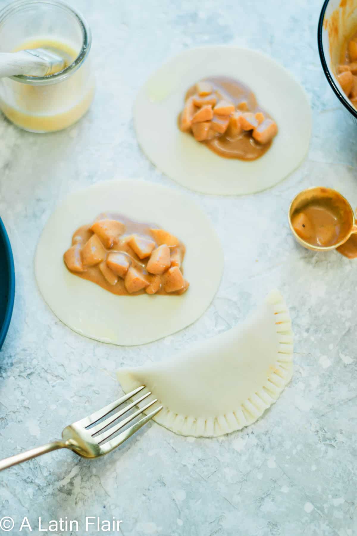 sealing the edges of fruit filled empanadas recipe