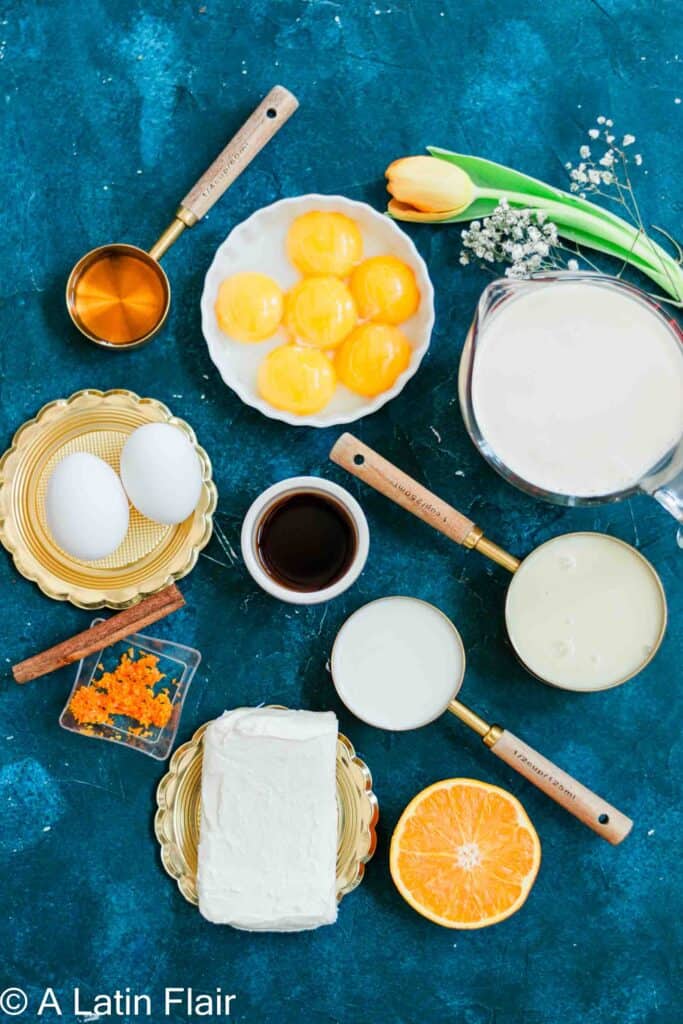 ingredients for Orange Flan Recipe (Flan de Queso Recipe con Naranja) on blue background