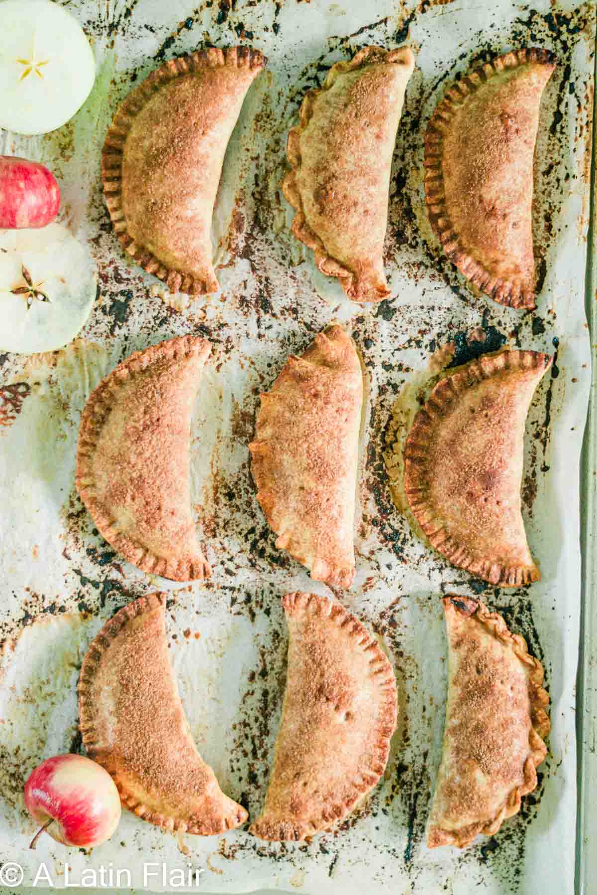 baked apple empanadas on baking sheet 