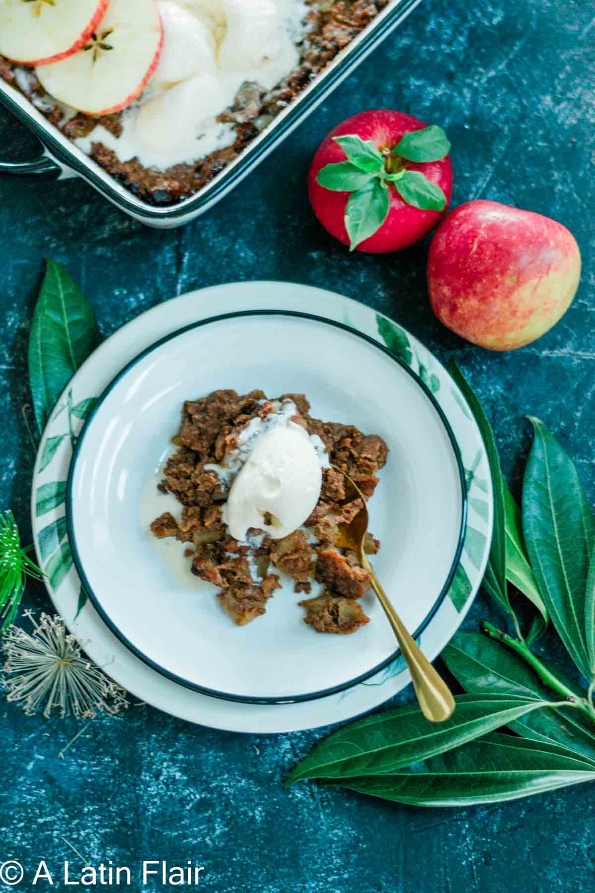 Apple Crisp served on white plate with gold spoon