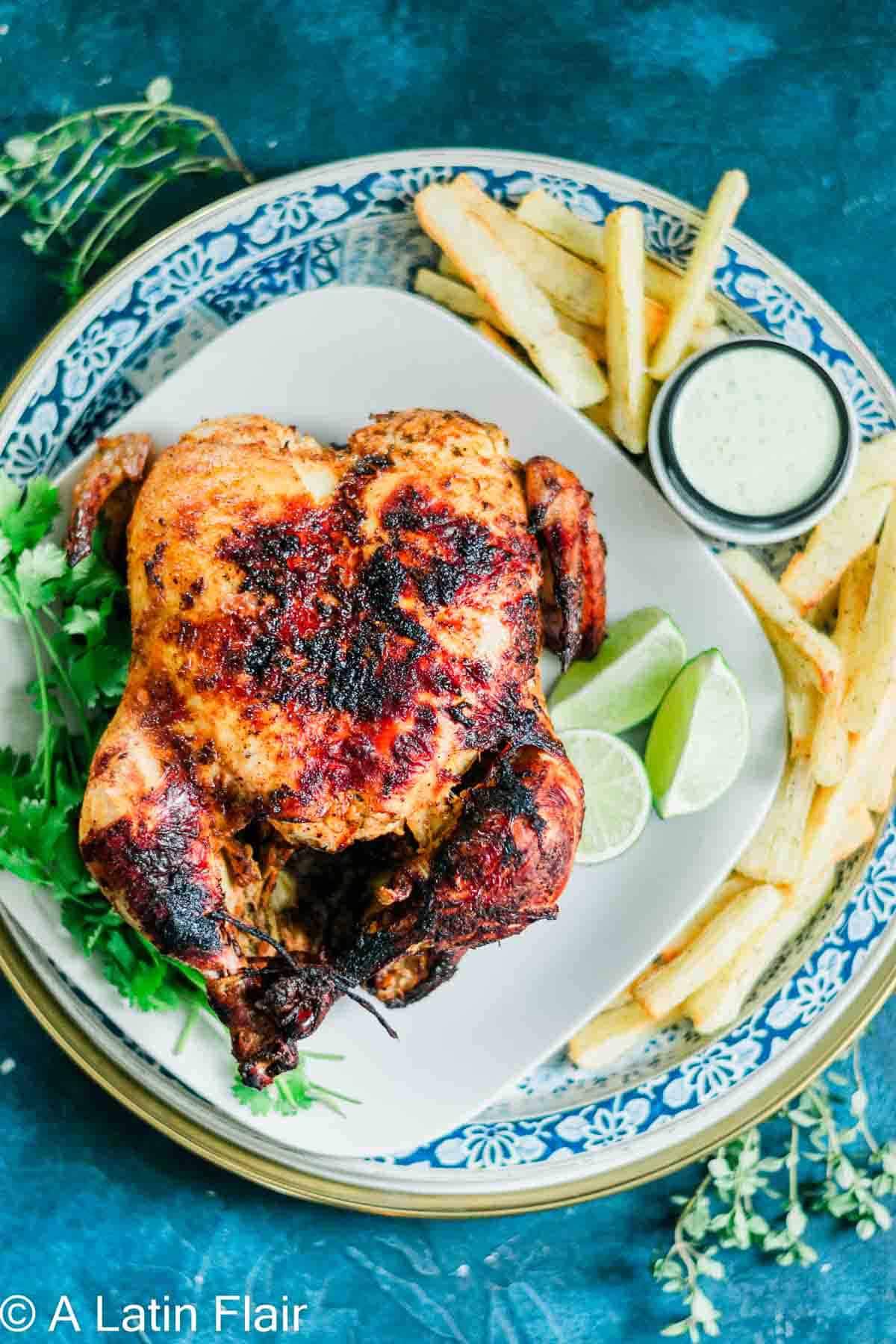 pollo en el air fryer (chicken asado recipes) on white plate