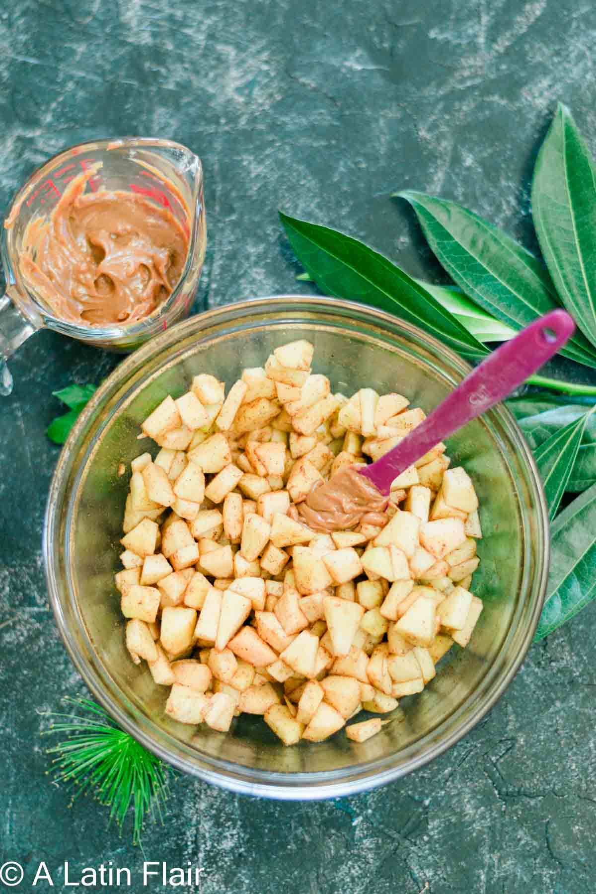 apple mixture and dulce de leche ingredients in bowls for apple crisp