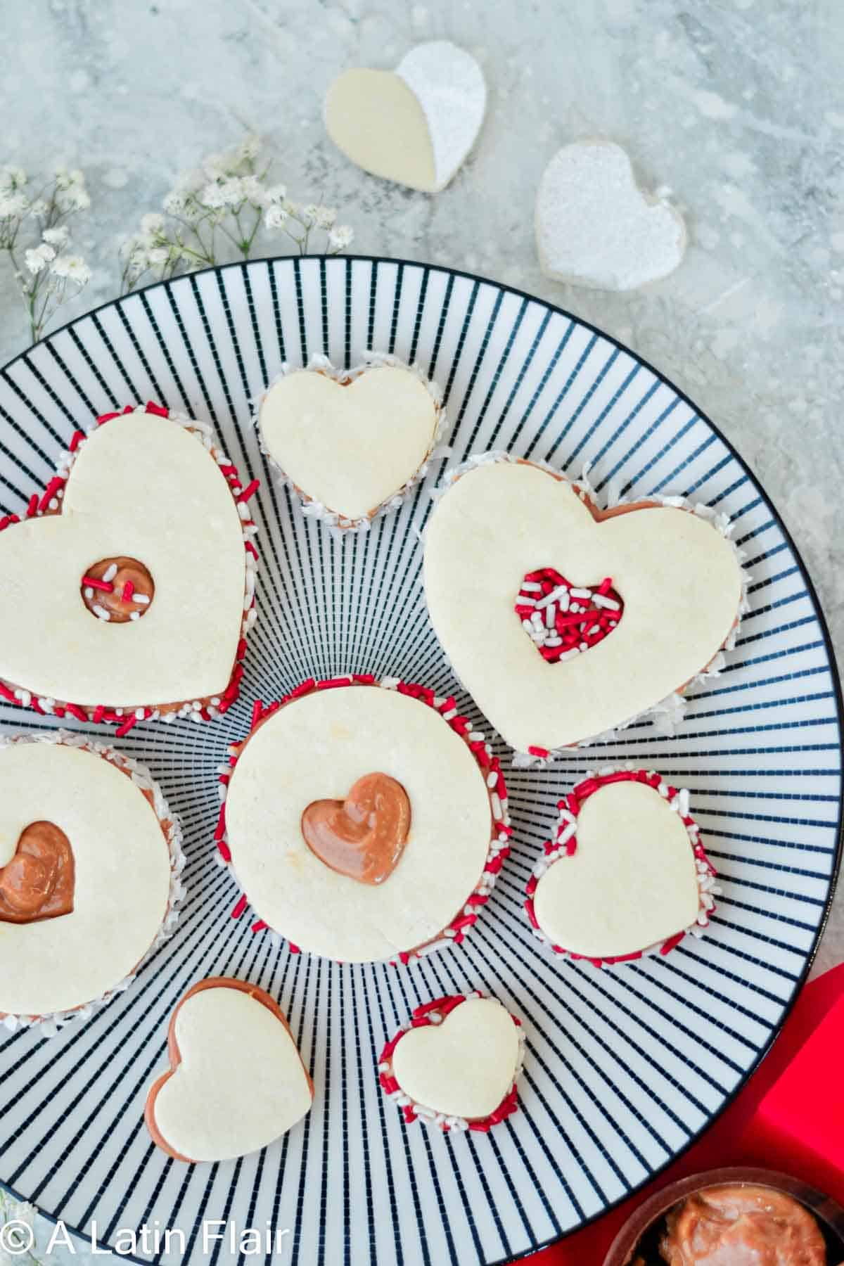 Hearts shaped Dulce de Leche Cookies on black and white plate