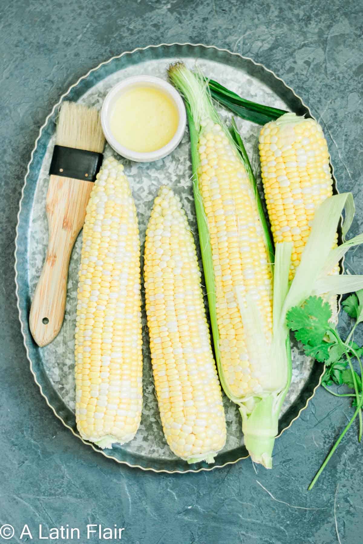 corn cobs on a tray for Elote Air Fryer 