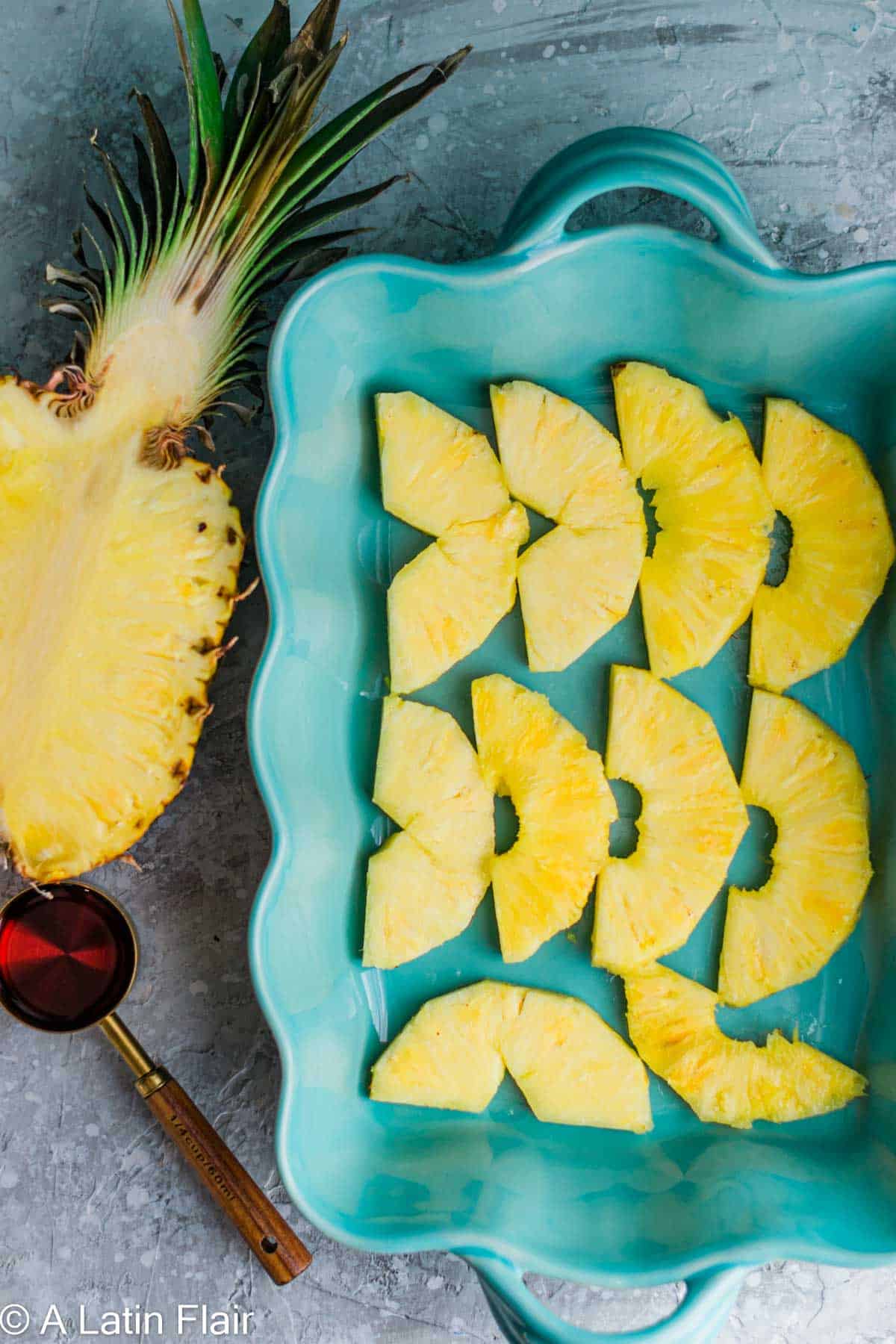 sliced pineapple in a pan for Upside Down Pineapple Rum Cake