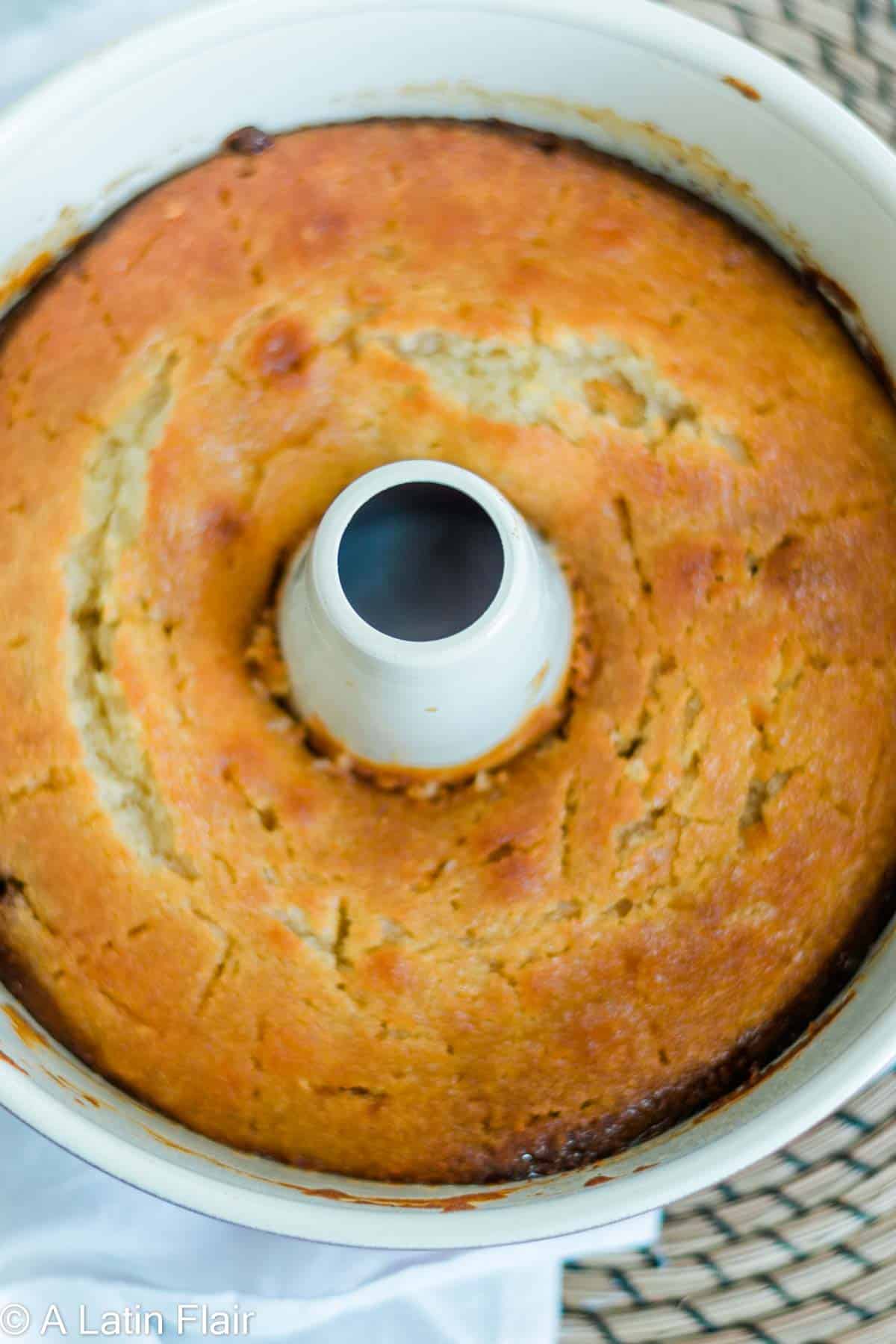 soaking cake with rum syrup for caribbean rum cake