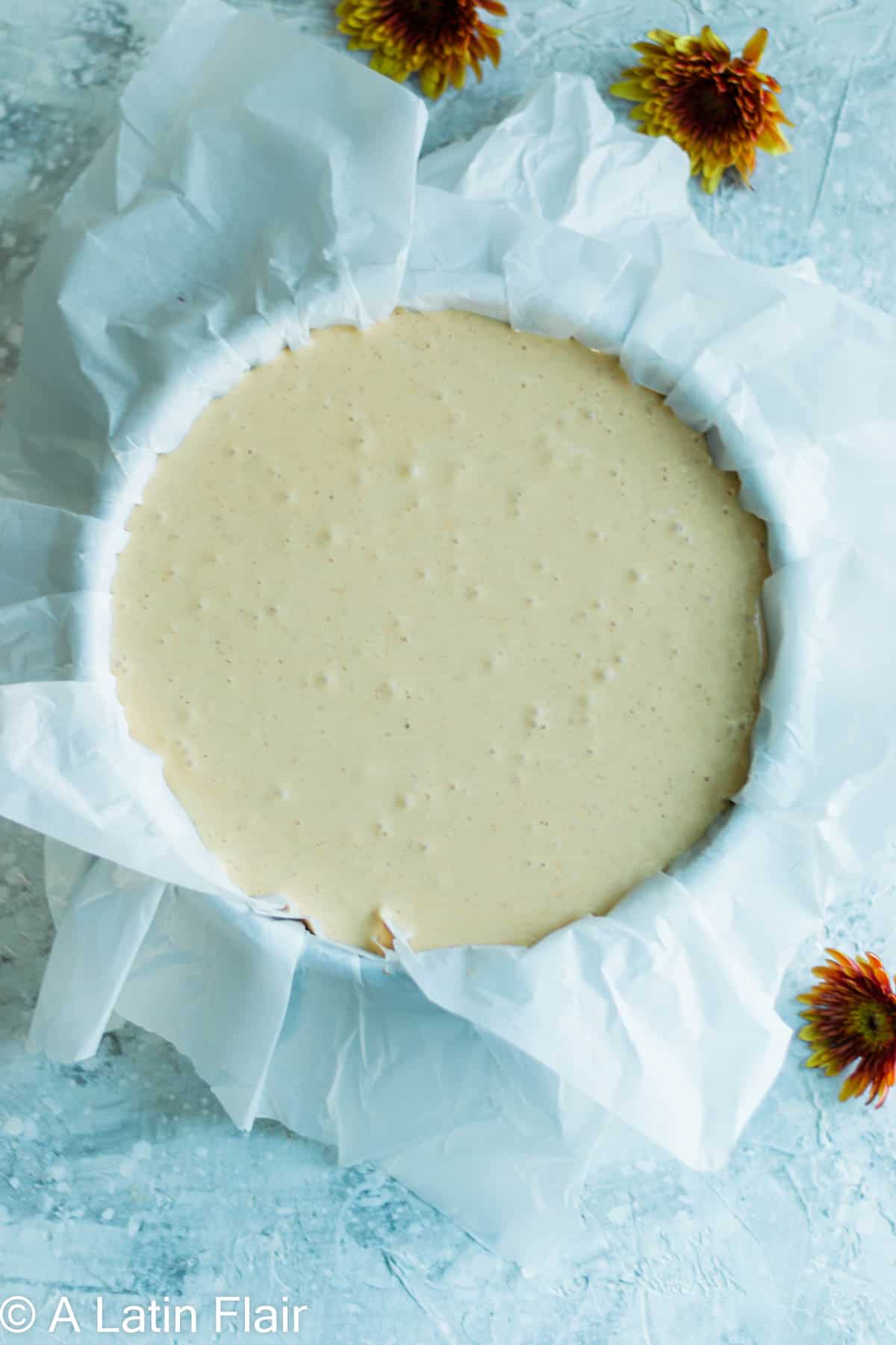 pumpkin basque cheesecake batter in baking pan