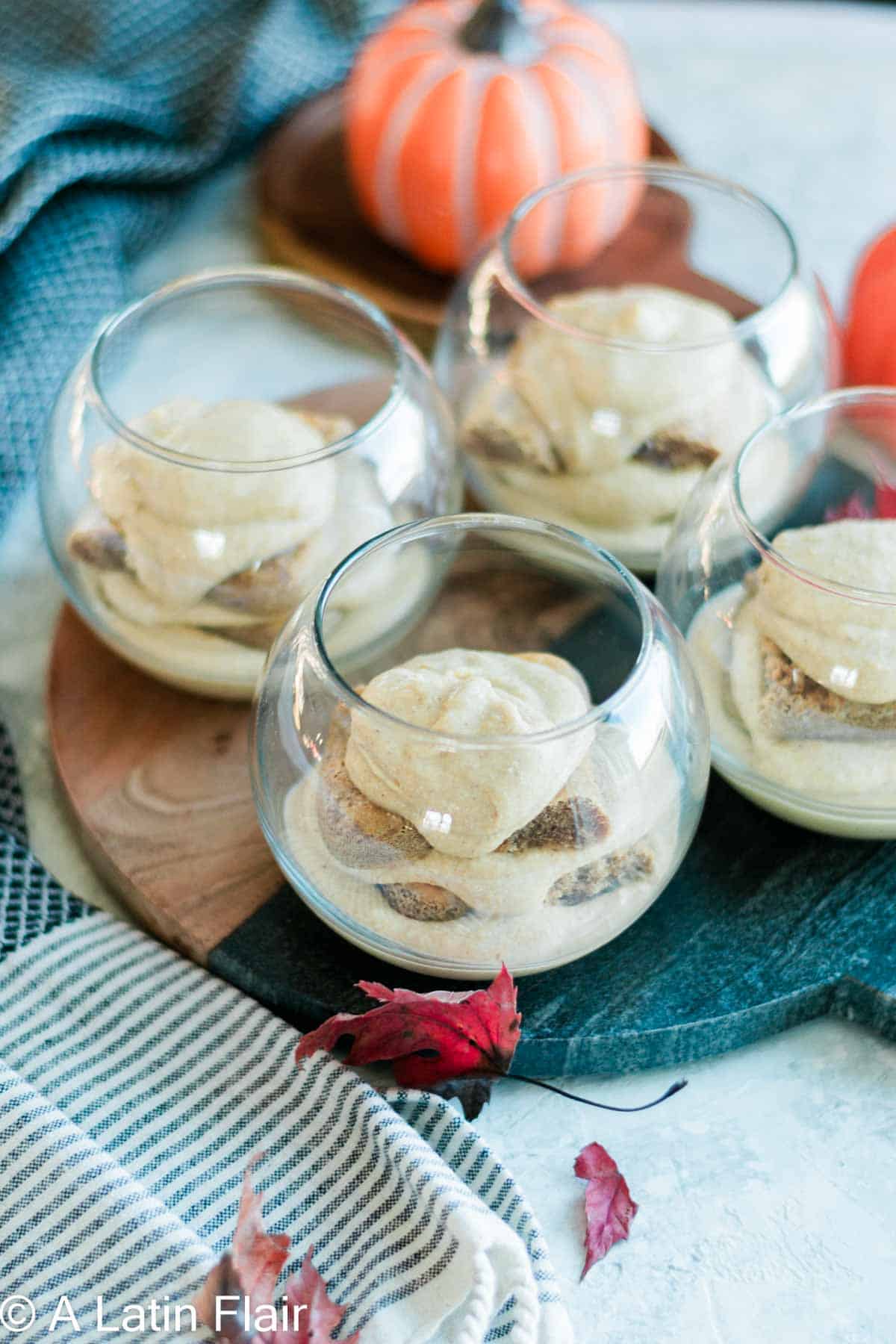 individual tiramisu recipe being layered in glasss cups