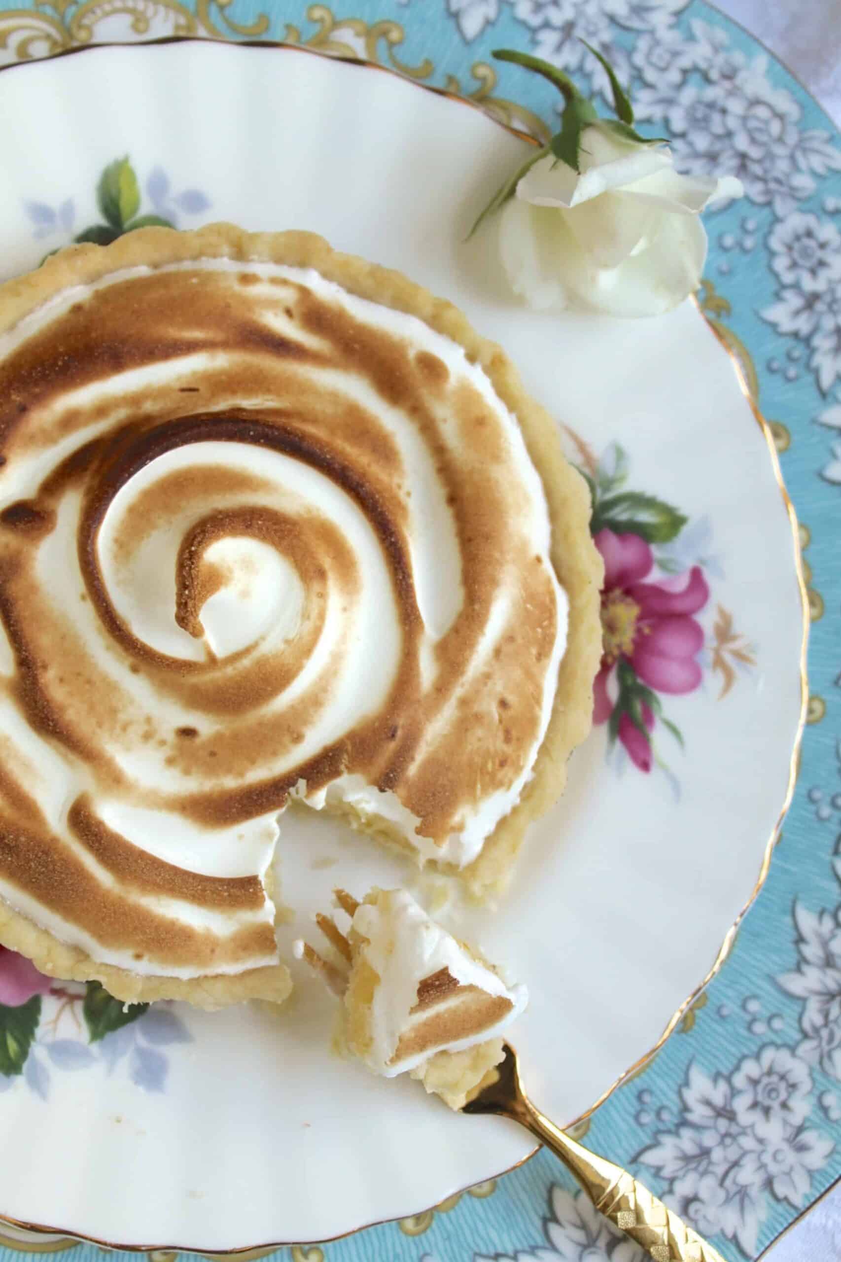 Passion fruit and lemon meringue tartlets.