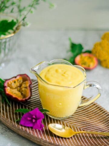 Passion fruit curd in glass cup.