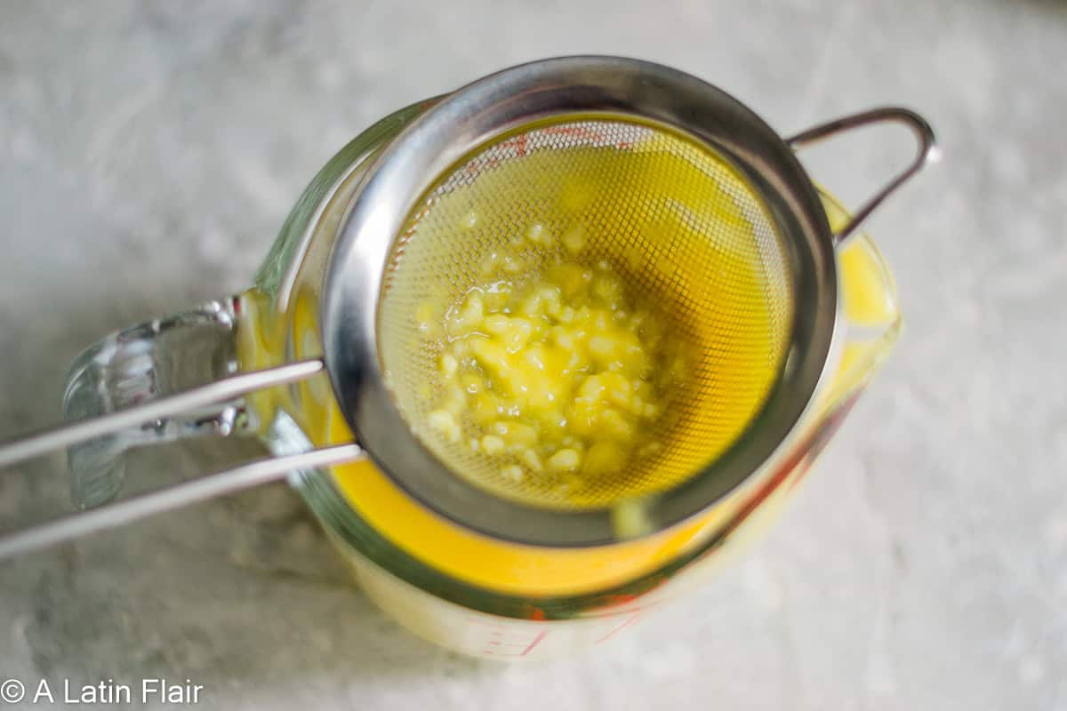 STRAINING Passion fruit curd